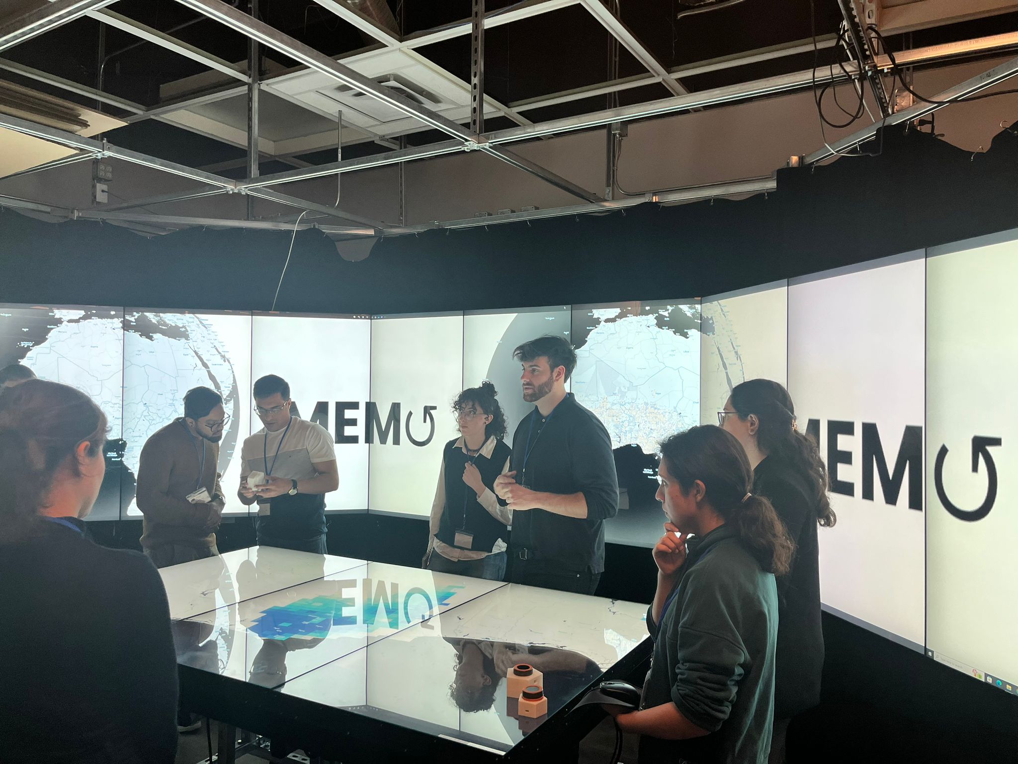 Audience around presentation table